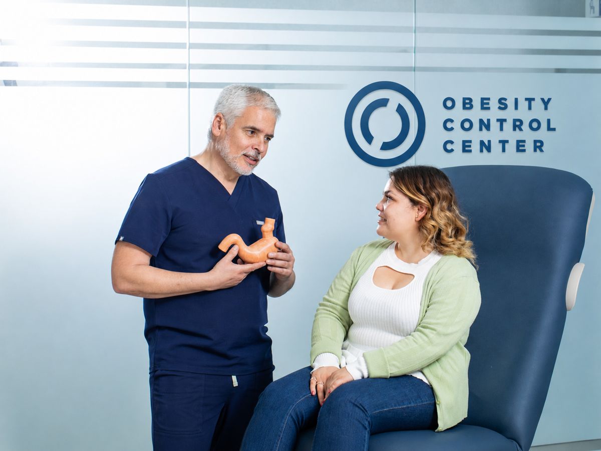 OCC surgeon explaining a gastric sleeve model to a patient
